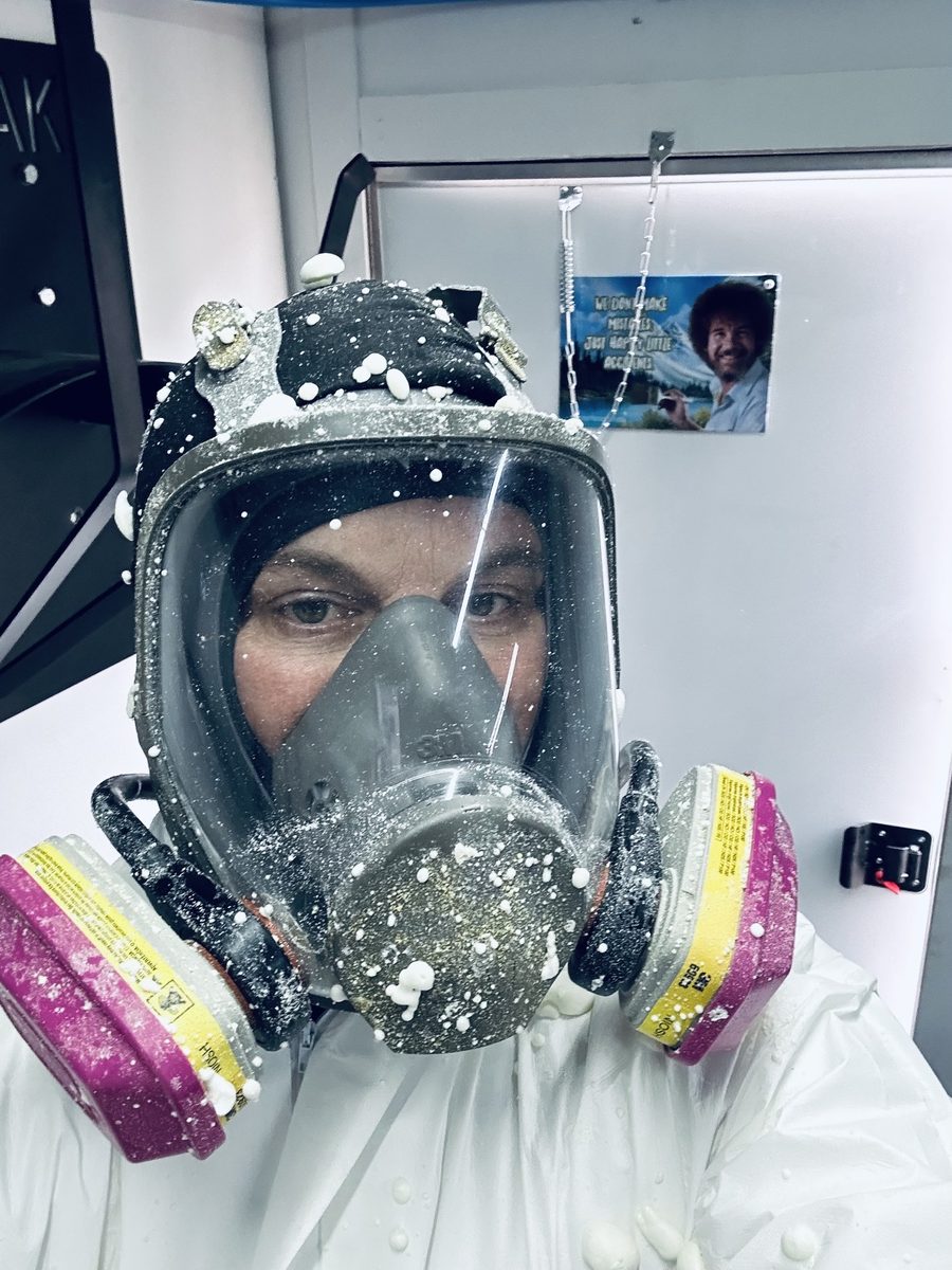 Hoss in his respirator, covered in spray foam
